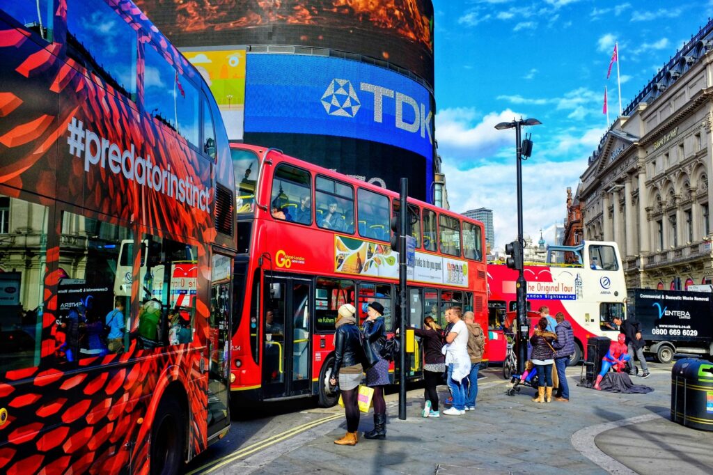 Passengers are waiting to ride the double-decker as they wait for the doors to open